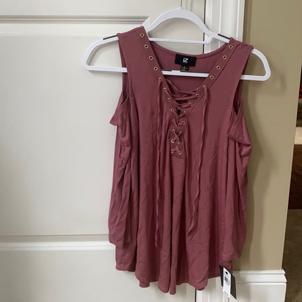 IZ Byer mauve long sleeve shirt with cut out for shoulders. Never worn before.